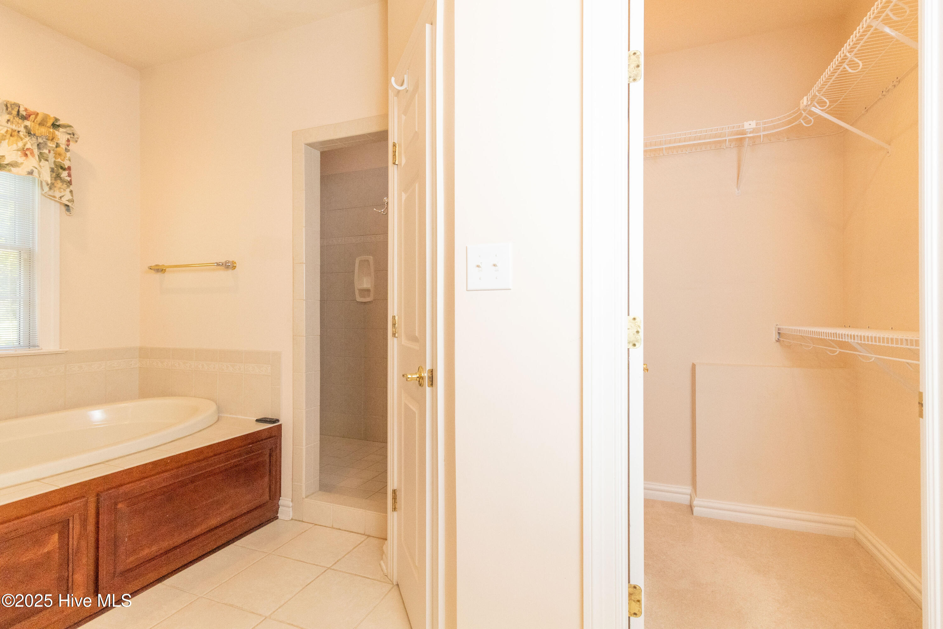 en suite walk-in closet in addtion to 2 others in bedroom