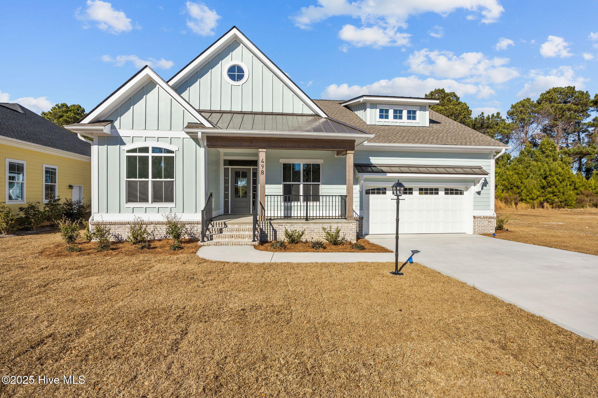 Welcome home to this amazing new construction home MOVE IN READY, located in the Lockwood Folly Golfing Community on the Intracoastal Waterway. A beautiful new 3 Bed 3 bath plan built by GHHP Luxury Home Builder. Come home and enjoy your peaceful private partially wooded lot with all the amenities that Lockwood Folly has to offer just minutes to Holden Beach. This home will have quartz counter tops, glass cabinets, dry bar and custom wood shelves and built ins.Enjoy high quality craftsmanship LVP floors, Trey ceilings and crown molding throughout as you enter your foyer adorned with wainscoting and French doors to your office/study. Step into your Great room with wood beam accent and herringbone tiled fireplace with natural wood shelving. Relax as you gaze through your luxury 8 foot sliders that open from both sides to allow easy enteritaining options and furniture layout, overlooking your private beautiful back yard with covered porch.  Make your favorite meal in your well appointed kitchen that boasts ample soft close cabinetry with glass top cabinets all the way to the ceiling and additional storage in center island. The primary suite is well appointed with all the extras, large walk in closet with wooden shelving, tiled herringbone walk in shower with rain head and wand, double sinks as well as a trey ceiling overlooking your treelined backyard. Escape to the second floor with a cozy retreat like feeling with lots of natural light given the extra window placement and full bath. Walk in attic access, mudroom with drop zone, plenty of storage and an oversized garage as well! Come and enjoy swimming or lounging at the large pool overlooking the Intracoastal.and Lockwood Folly River or Dine at the Restaurant on the water after a round of golf. Plenty of activities to enjoy such as tennis, bocce ball, or basketball, fishing from the pier or launch your boat/kayak and enjoy a day out on the water. Coastal Living at its best!