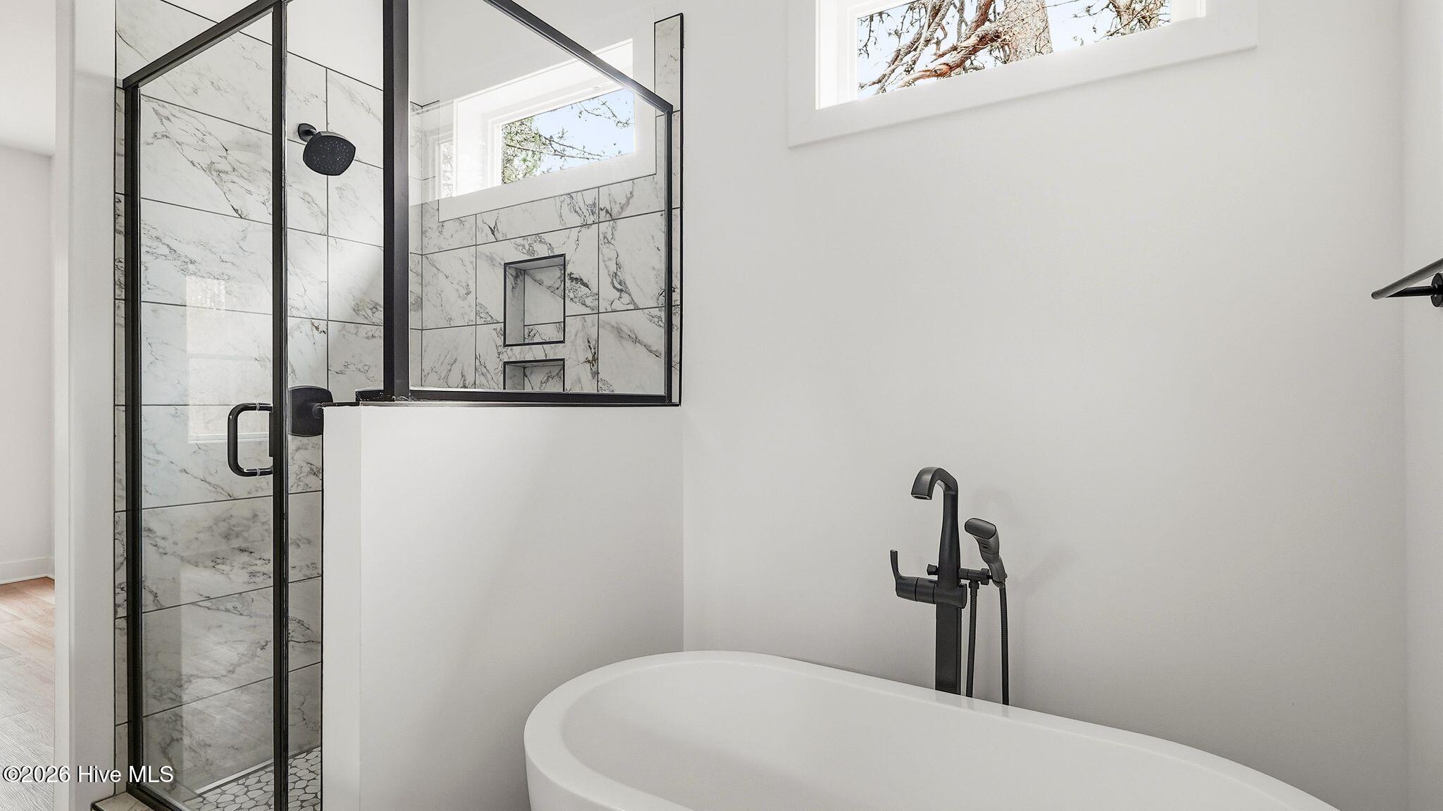 Walk-in shower with glass doors