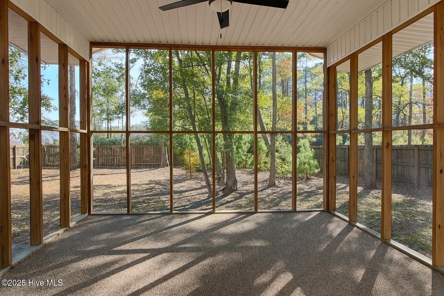 9117 Landing Drive SW, Calabash, NC 28467 – photo 6: Serene Porch Overlooking Autumn Backyard
