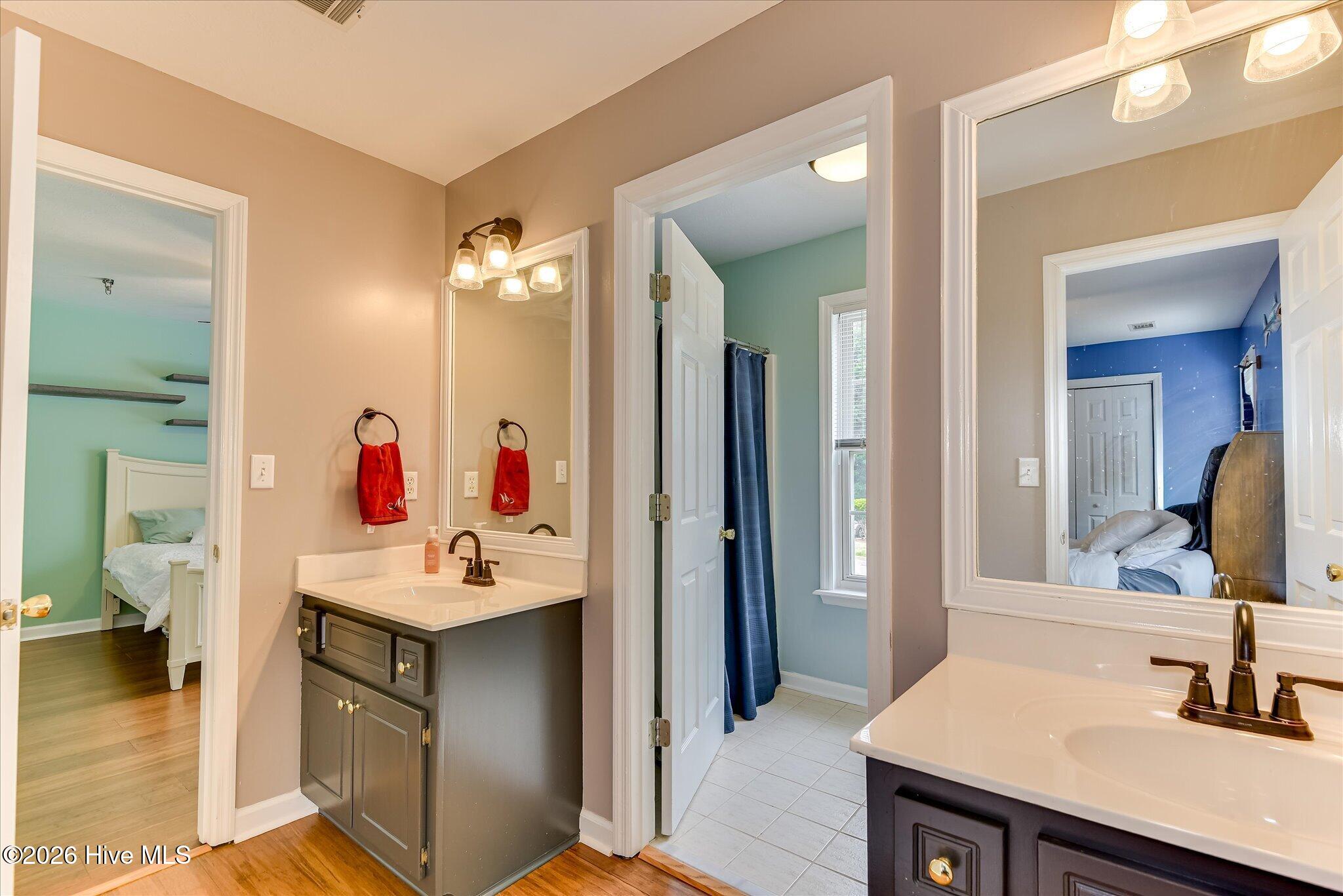 Full Bath in Secondary Bedroom areas, Double Sinks with Separate tub/toilet room. Entrances into 2 secondary bedrooms is the ultimate convenience!
