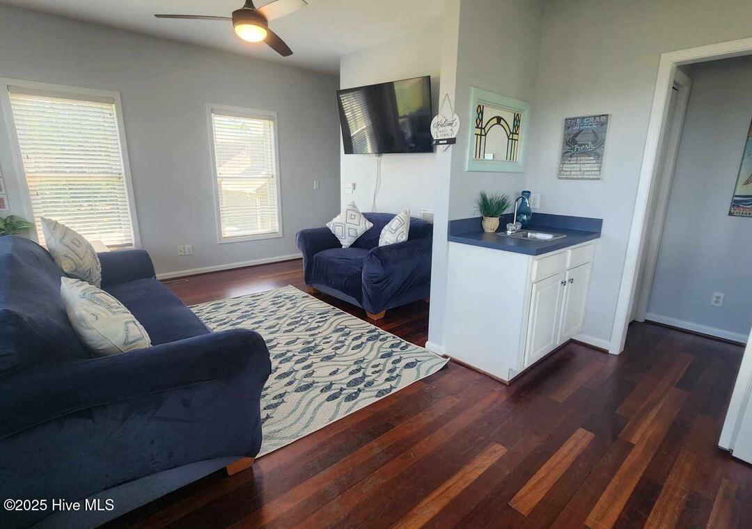 Lower level wet bar, mini fridge, off lower level living room and 2 primary bedrooms