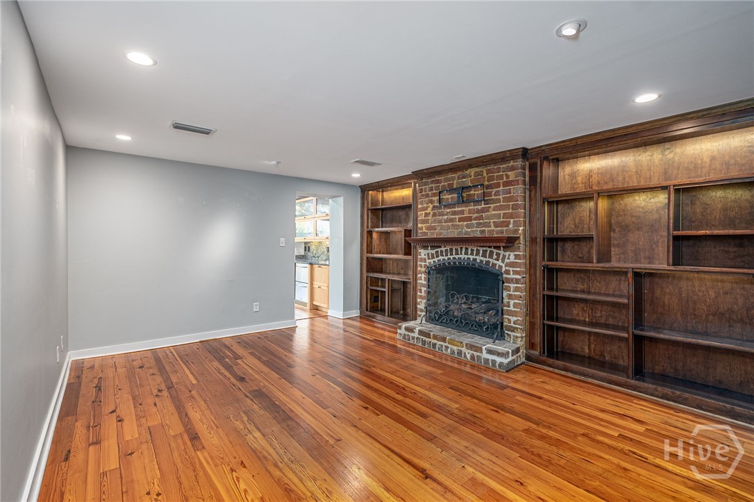 Family room on garden level with functioning fireplace