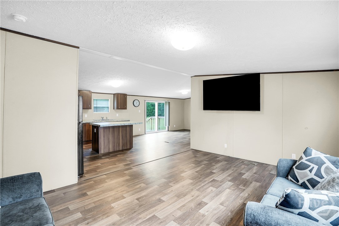 Entertainment area view to the kitchen and breakfa