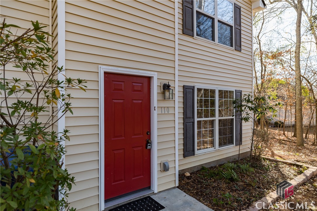 Renovated in Snapfinger Woods! Take advantage of the convenience of a refreshed and updated space. 110 Snapfinger Ln has undergone extensive upgrades including brand-new LVP flooring, plush carpeting, and fresh paint throughout. The roof and HVAC system are also new, ensuring your comfort and peace of mind. The home sits on a generously sized, partially wooded lot spanning 0.41 acres offering the perfect balance between nature and residential living. The convenience of a two-car attached garage makes parking a breeze, adding comfort to your daily routine. French doors open from the dining area to an outdoor patio where you can enjoy grilling with neighbors or simply unwind after a long day. Stepping inside, you’ll find the main living area provides ample space for family or guests. The wood burning fireplace creates a cozy focal point in the heart of the home and flows nicely into the dining area and kitchen. Heading upstairs, notice the new plush carpeting in each of the four bedrooms. The primary bedroom features an ensuite bathroom and sizable walk-in closet. The accessibility of the washer and dryer on the same level as the bedrooms makes doing laundry more efficient - no more lugging laundry baskets up and down stairs. Snapfinger Woods’ location adds an extra layer of appeal, combining a tranquil residential setting with close proximity to East Athens amenities and The University of Georgia Veterinary Teaching Hospital. Ready to make this ‘no renovations required’ house your home? Get in touch today to learn more or schedule a tour.