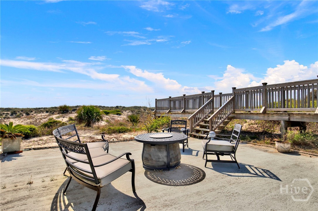 YES…. The patio with the fire pit is in the dunes in front of the home.