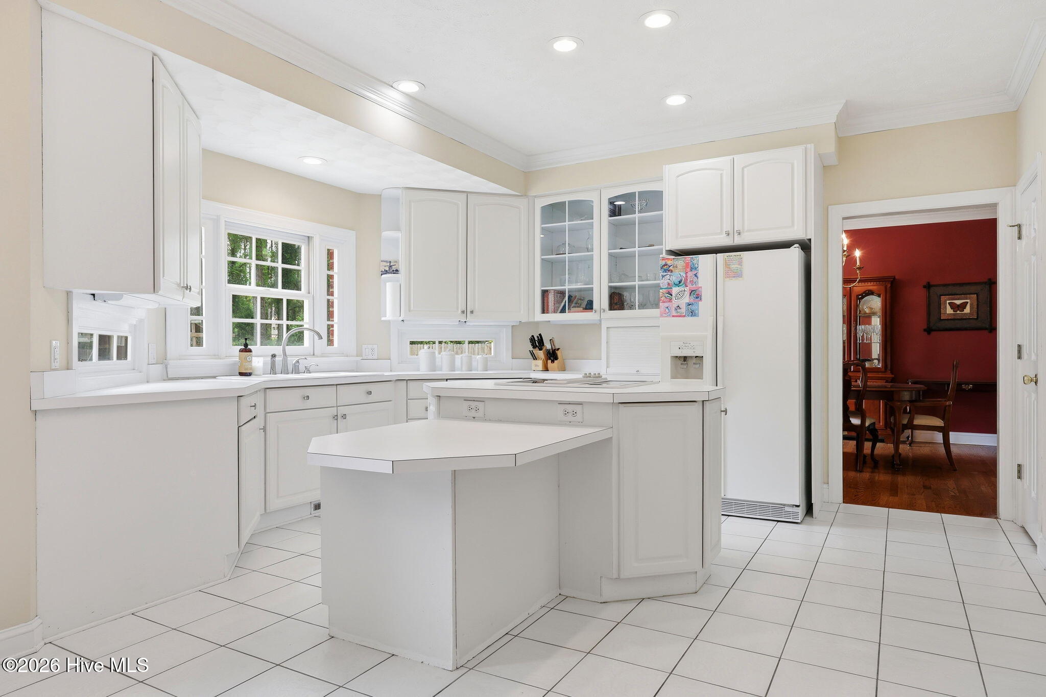 the kitchen is ideal for overlooking the back yard activities and the layout is spacious