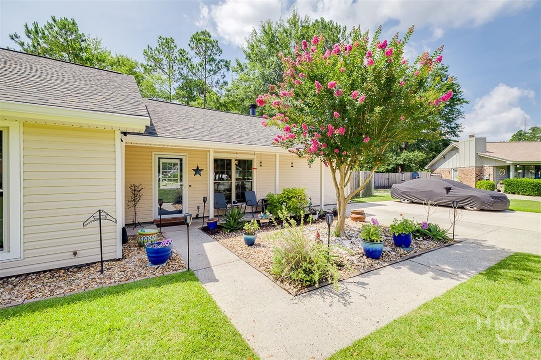 Thoughtful landscaping welcome you to the property, and a covered front porch to sig and enjoy.