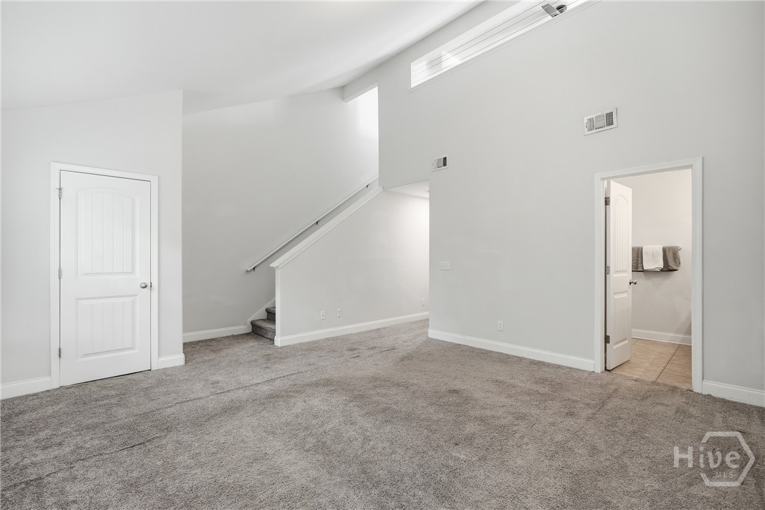 The expansive primary offers a loft above the bedroom. Great for yoga, a nursery or an office.
