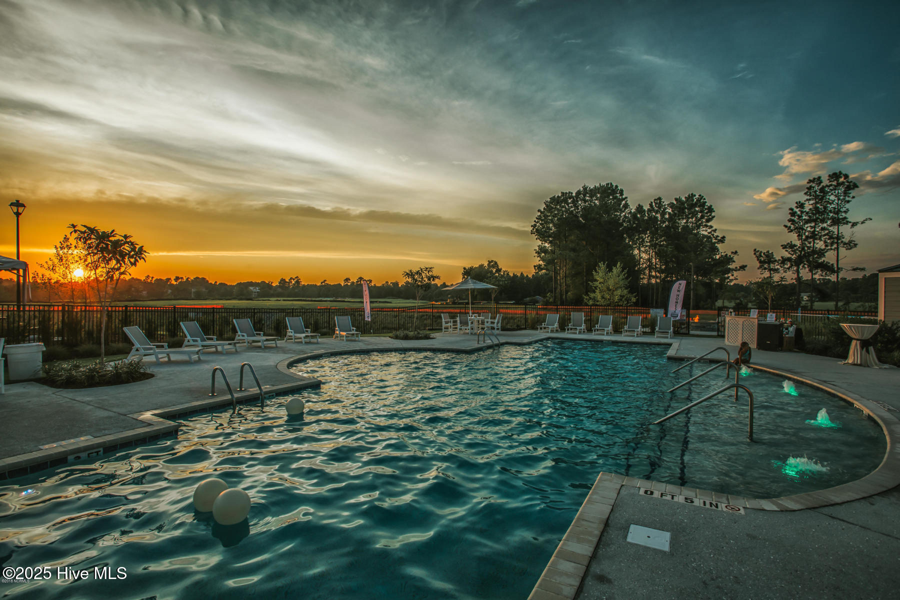 Community pool with sunset over Pages Creek