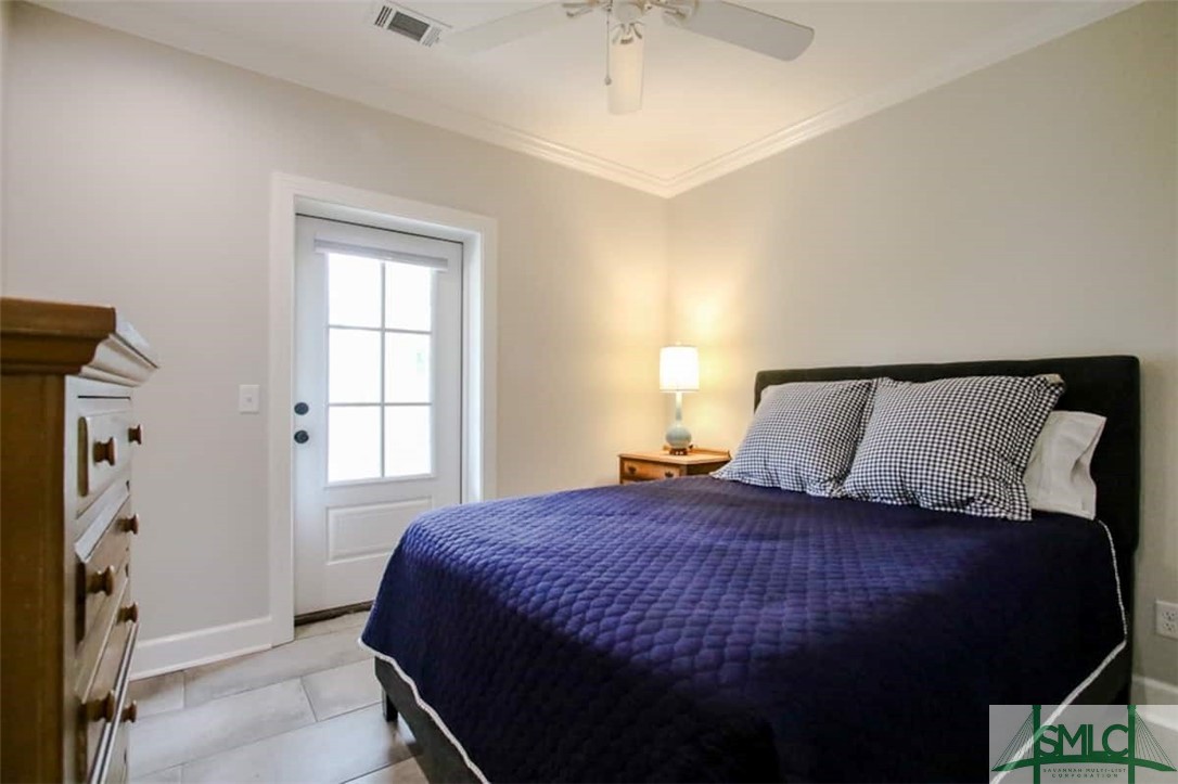 Bedroom with access to back porch