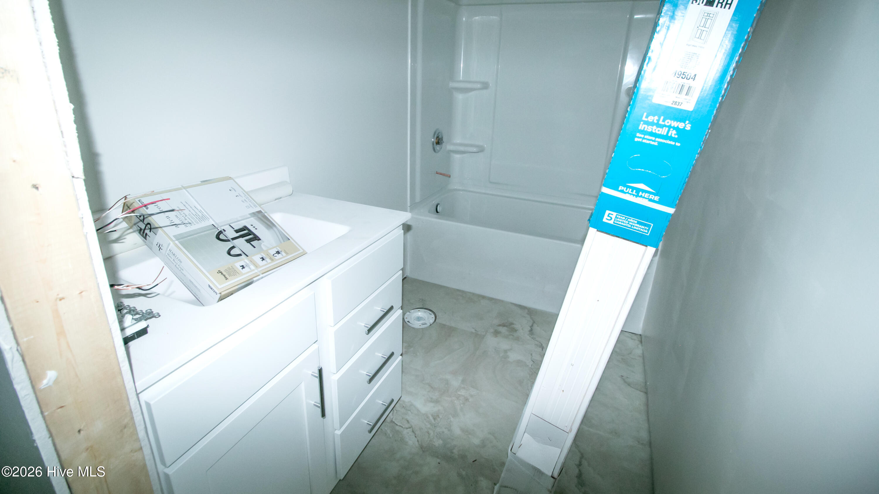 Bathroom sink, tub, and floors