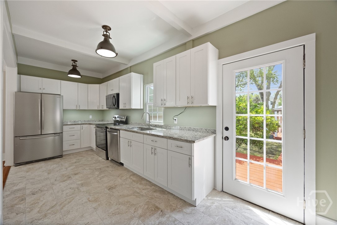 Kitchen with access to backyard