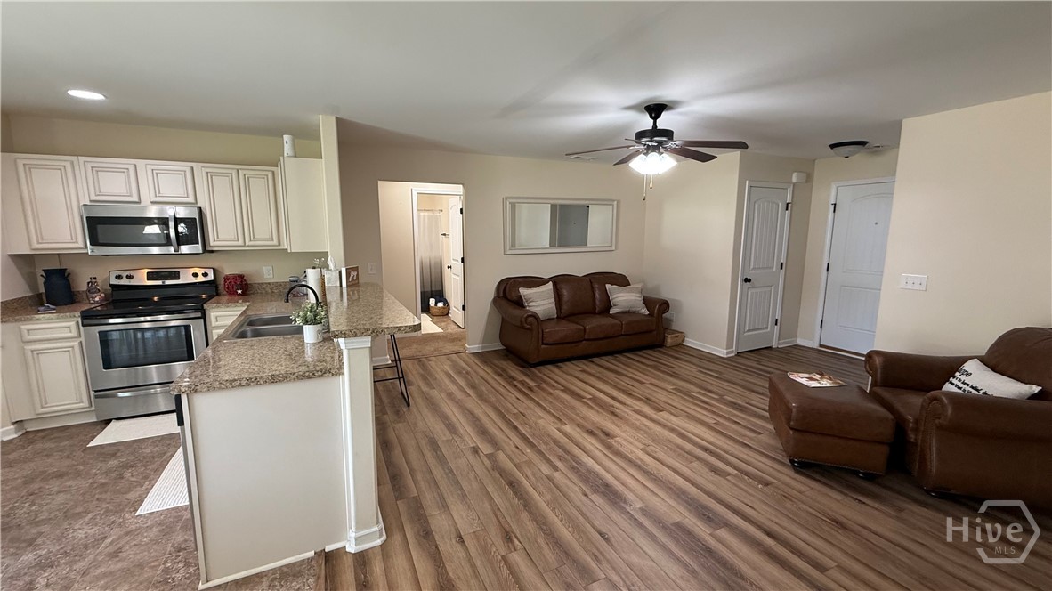 Open concept with eat at bar top.