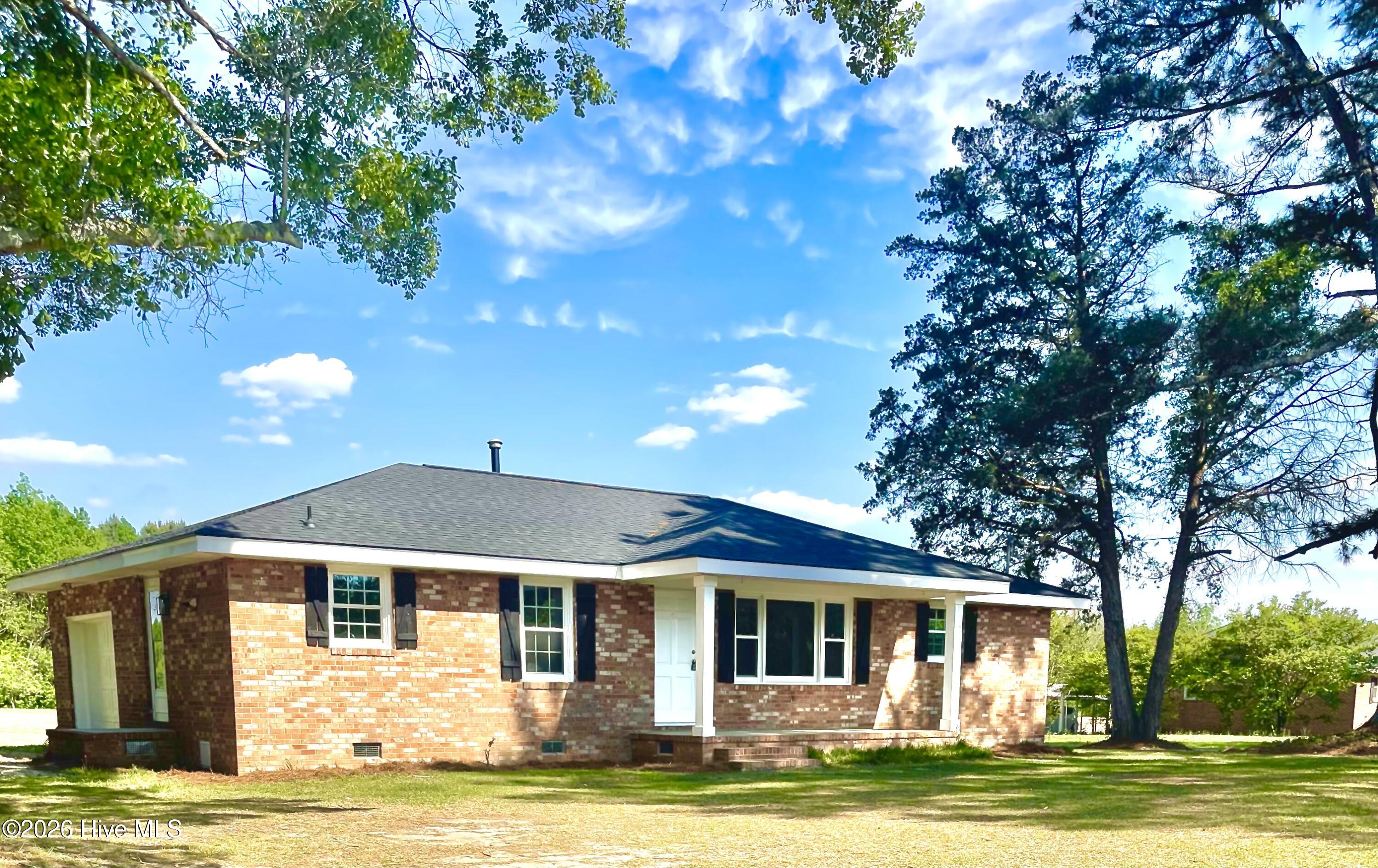 Enjoy peaceful country living while remaining less than 15 miles from Wilson's shopping, restaurants, and conveniences! This beautifully remodeled, one level brick home with a cute front porch features 3 bedrooms, 2 full bathrooms, new roof, new LVP flooring, new interior paint, new granite countertops, vinyl windows, new garage door and opener, & remodeled bathrooms!  New HVAC to be installed prior to closing.  With over an acre of land, there is plenty of room for entertaining - parking, play area, or adding a workshop or building! Listing agent is related to the seller