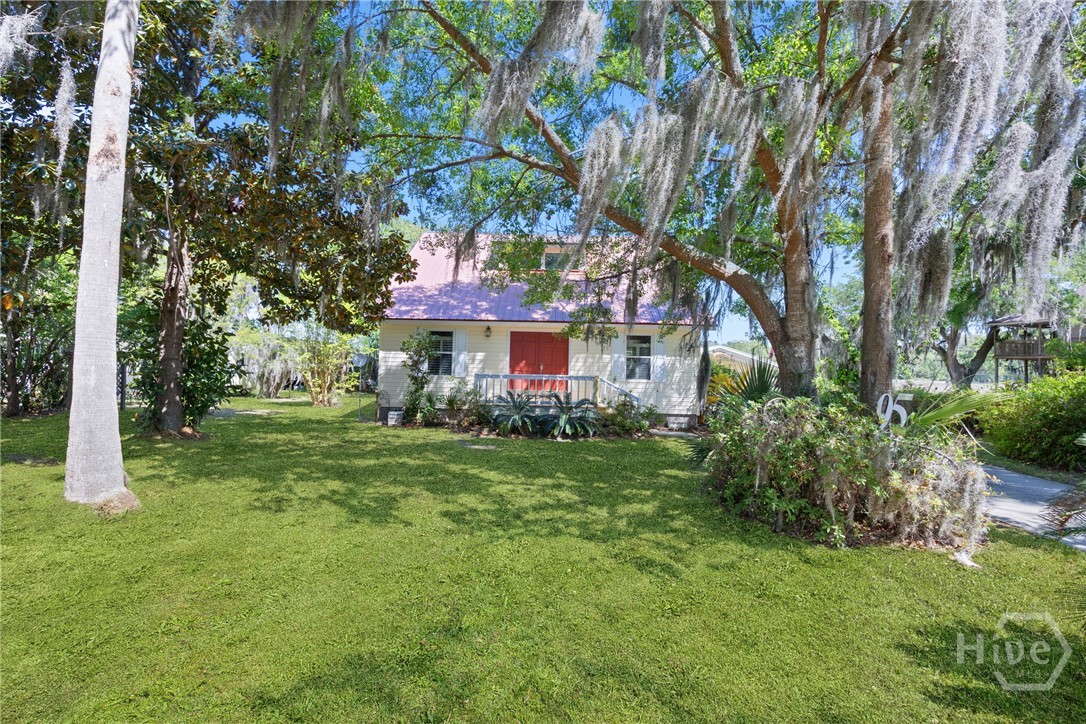 Charming cottage-style exterior tucked beneath mat
