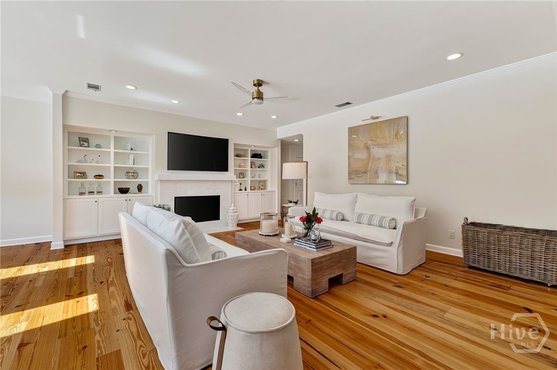 Family Room overlooking pool and lagoon with fireplace