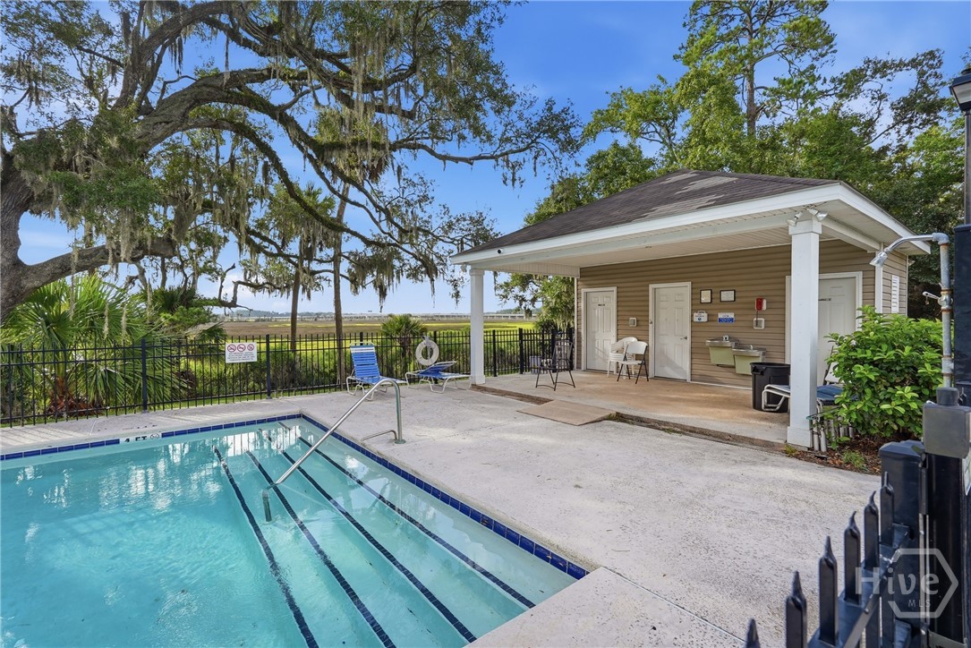 Community pool and pool house overlooks the marsh.