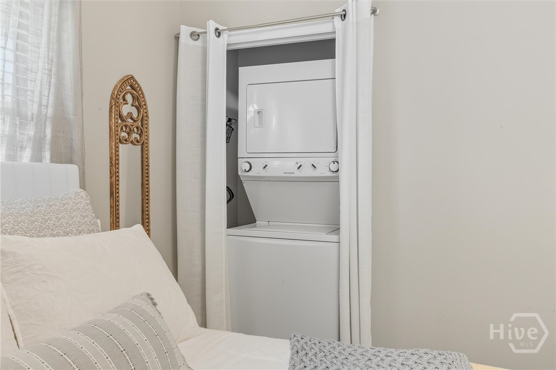 The laundry is located in the second bedroom.
