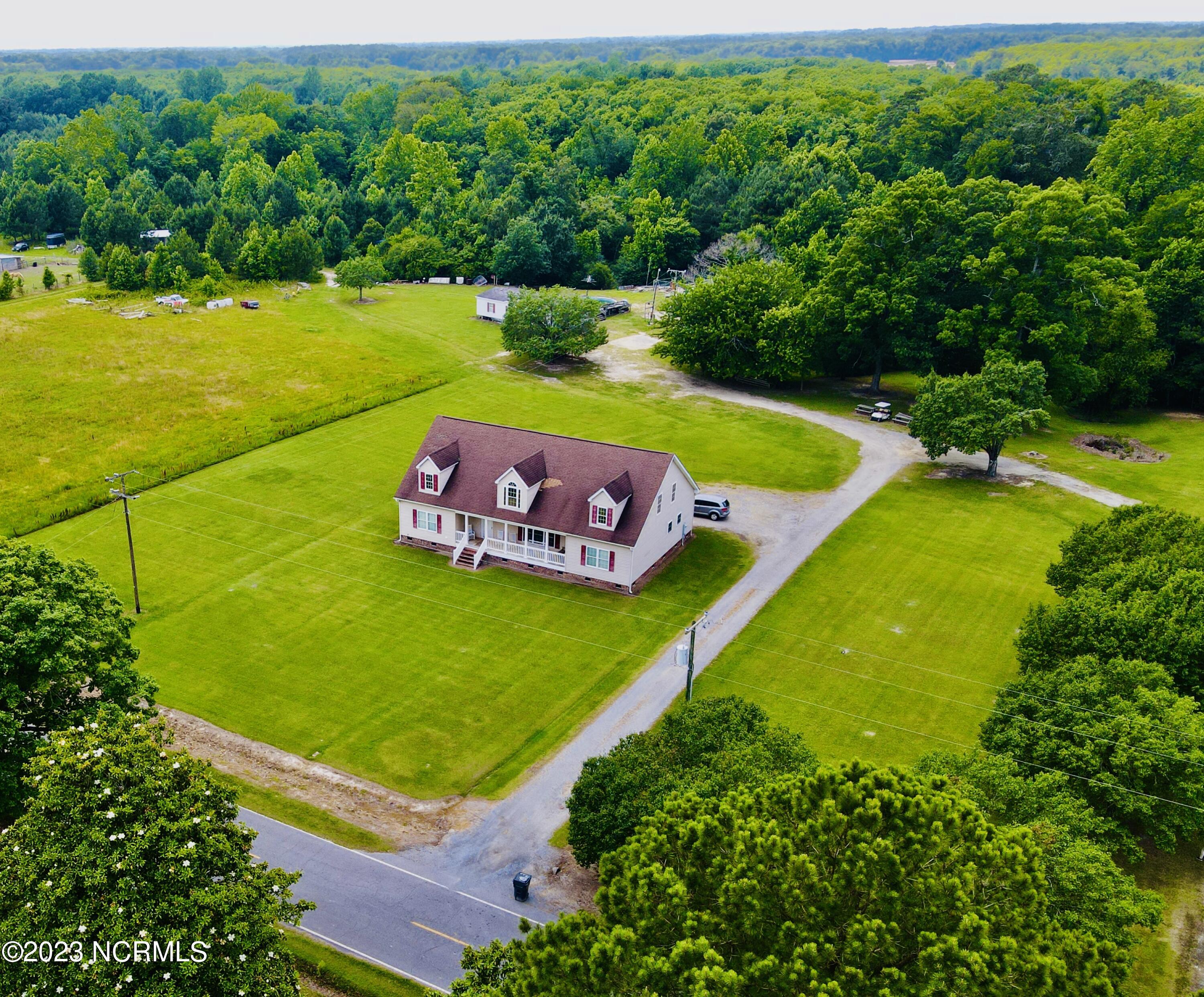 This is an exceptional opportunity to acquire a 3-bedroom, 2-full bathroom modular home located in the Farm Life Community! No Zoning and No City Taxes! This property is located on an approx. 1-acre lot and has many features such as a beautiful front foyer entrance that leads to an unfinished 2nd story which has so many unlimited opportunities! The grand kitchen features a stainless-steel appliance package, built in office work zone area, a butler's pantry, and a formal dining room. The master bedroom features a HUGE walk-in closet and an attached master bathroom with double vanities, a large relaxing garden tub and a separate stand-up shower. This home also includes a large open ''living room-kitchen-dining room'' design that is perfect for entertaining or having family gatherings!  Each additional private bedroom also includes large walk-in closets, and the entire house has 9ft ceilings. Spend your hot summer days eating popsicles on the front covered county porch while catching up with old friends! Schedule your tour today before it's too late!