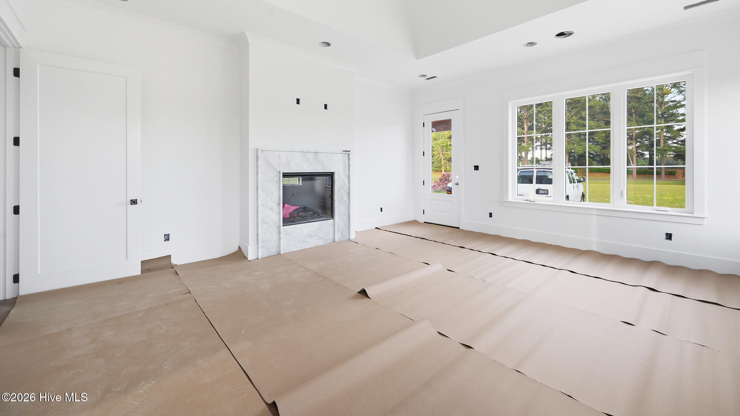 marble surround fireplace in owner suite