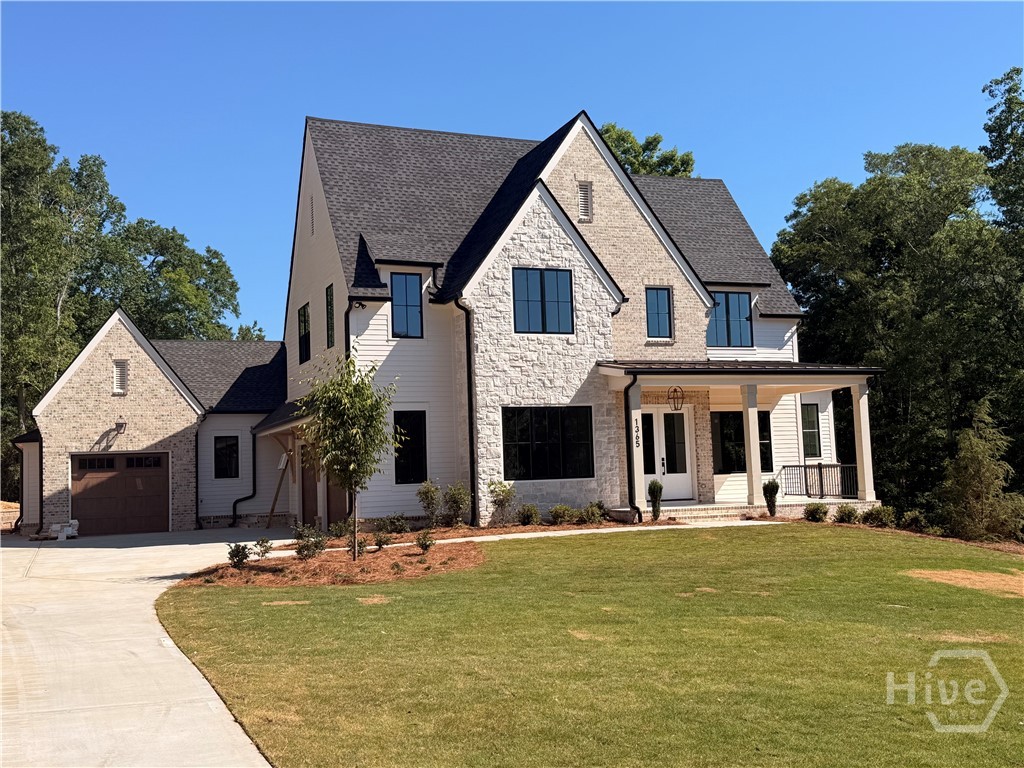 Set within the highly coveted Spartan Estates, this exceptional new construction residence offers 4,695 square feet of refined living on a lush 1.31 acre homesite, thoughtfully designed to elevate both everyday comfort and elegant entertaining. From the moment you enter, soaring 10-foot ceilings on both levels, enhanced by dramatic vaulted accents, create an airy, light-filled atmosphere that underscores the home’s architectural sophistication.The main living spaces strike a perfect balance between timeless elegance and modern functionality. The coffered family room anchors the home with custom built-ins flanking a raised-hearth gas fireplace, creating a warm yet refined focal point. A handsome study, complete with a wall of built-ins, offers a private retreat ideal for a home office.At the heart of the home, the gourmet kitchen is expertly designed for both the culinary enthusiast and the adept host. It features a generous center island, Thermador Professional appliances, and a wet bar with dedicated ice maker. A thoughtfully appointed scullery with full-size wine refrigerator provides additional storage and an ideal catering/prep space, keeping the main kitchen effortlessly pristine.The vaulted primary suite on the main level serves as a serene sanctuary, offering direct access to the covered patio and a spa-inspired bath with a soaking tub, frameless glass shower, and a custom walk-in closet with center island and direct access to the laundry room. The upper level includes three generously sized bedrooms, two with en suite baths, along with a versatile bonus room featuring 12-foot ceilings and a convenient second laundry.Completing the home is a large unfinished basement stubbed for a full bath, offering endless opportunities for future expansion. Additional highlights include a covered patio with gas fireplace, three-car garage, tankless water heaters, spray foam insulation, generator-ready wiring, an irrigation system, and upgraded Pella windows—all reflecting the exceptional craftsmanship, energy efficiency, and luxury appeal of this Spartan Estates residence.