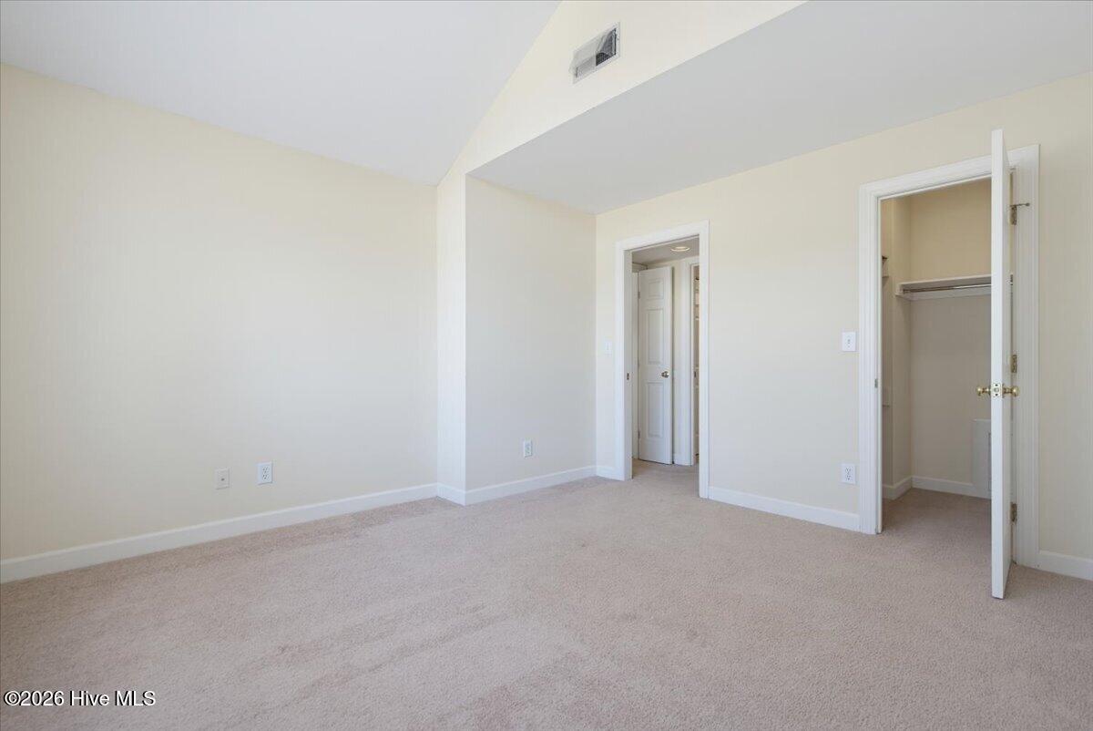 Bedroom with walk-in closet