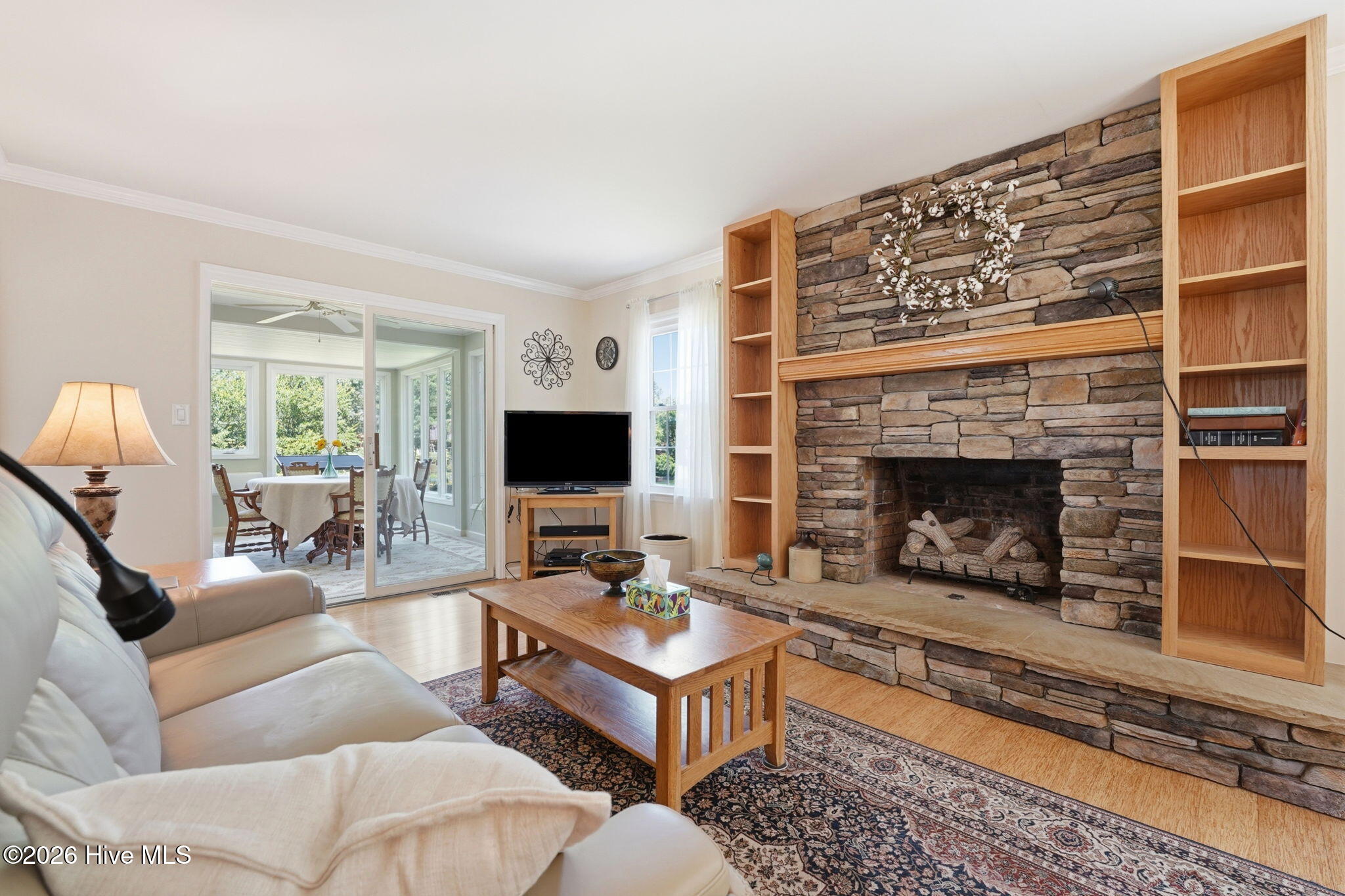 Get comfy in the living room with a cozy fireplace and a bit of a water view.