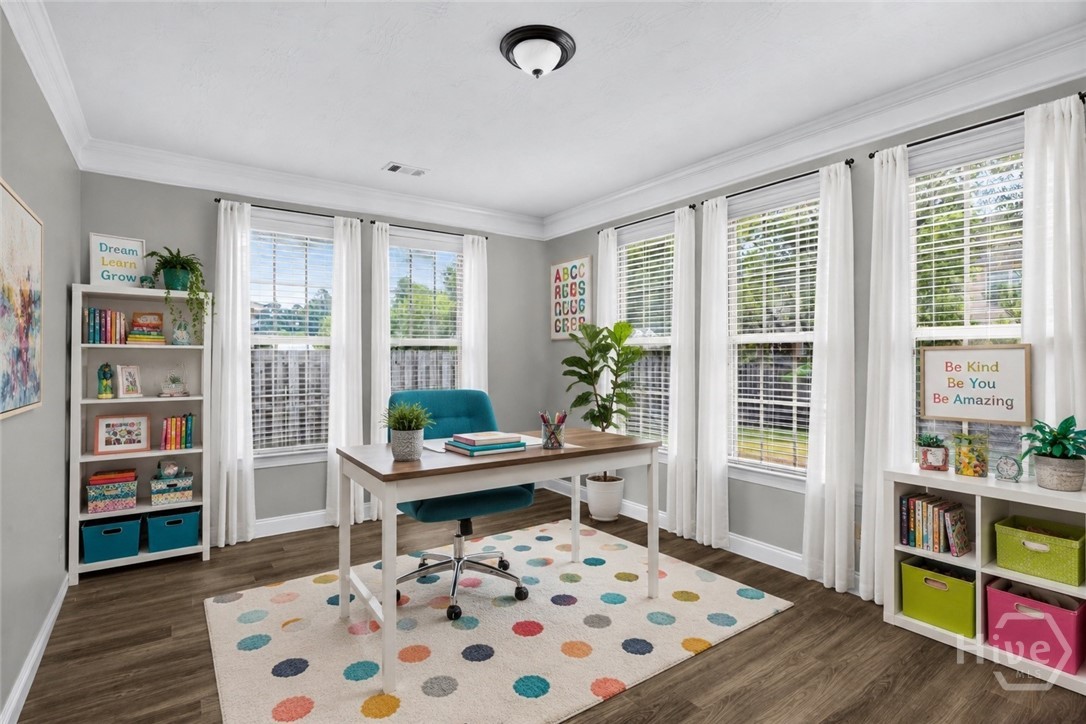 Flex room off kitchen virtually staged as home school classroom
