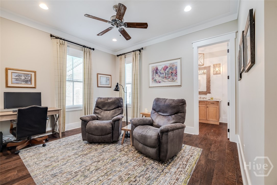 Downstairs den/study with access to half bath