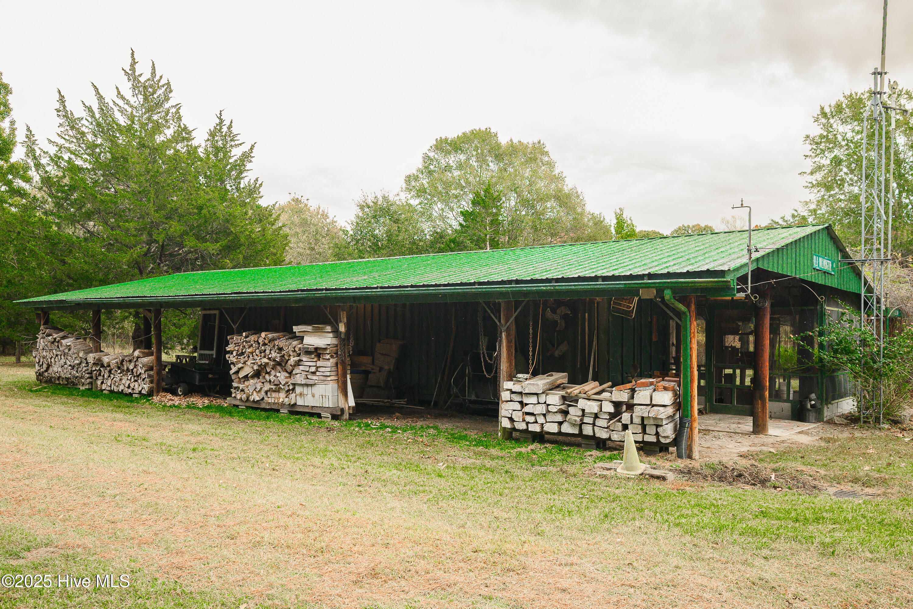 Storage Container with electricity and lean for storage on one side, Green House on other side.
