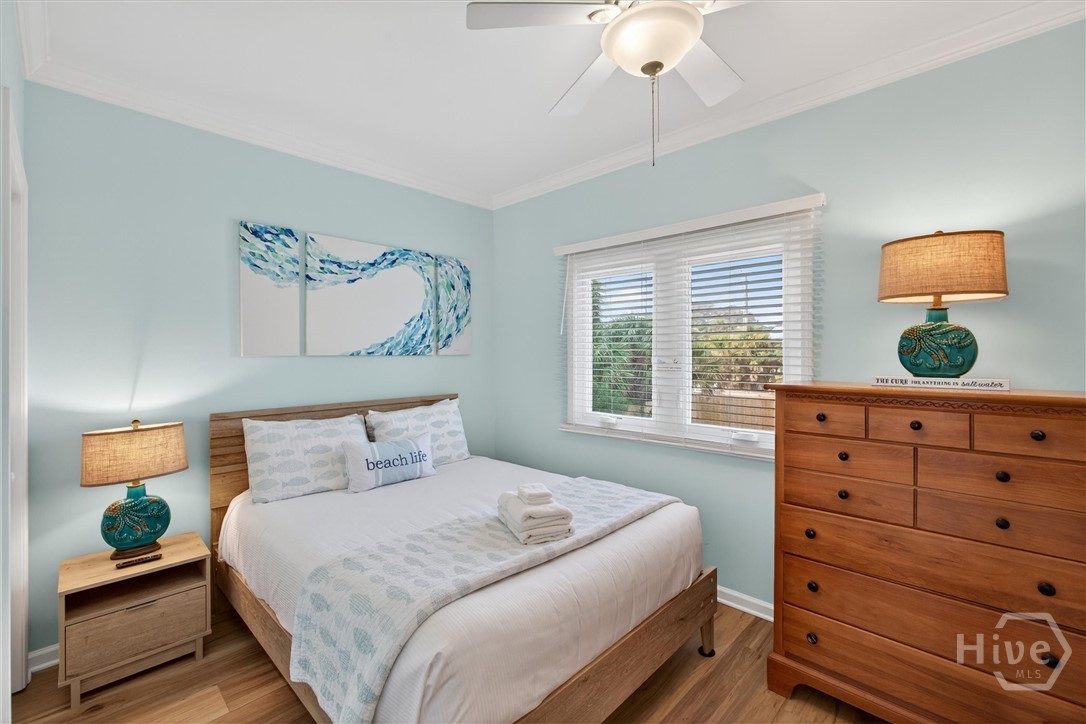 Main floor guest room with queen and twin bed.