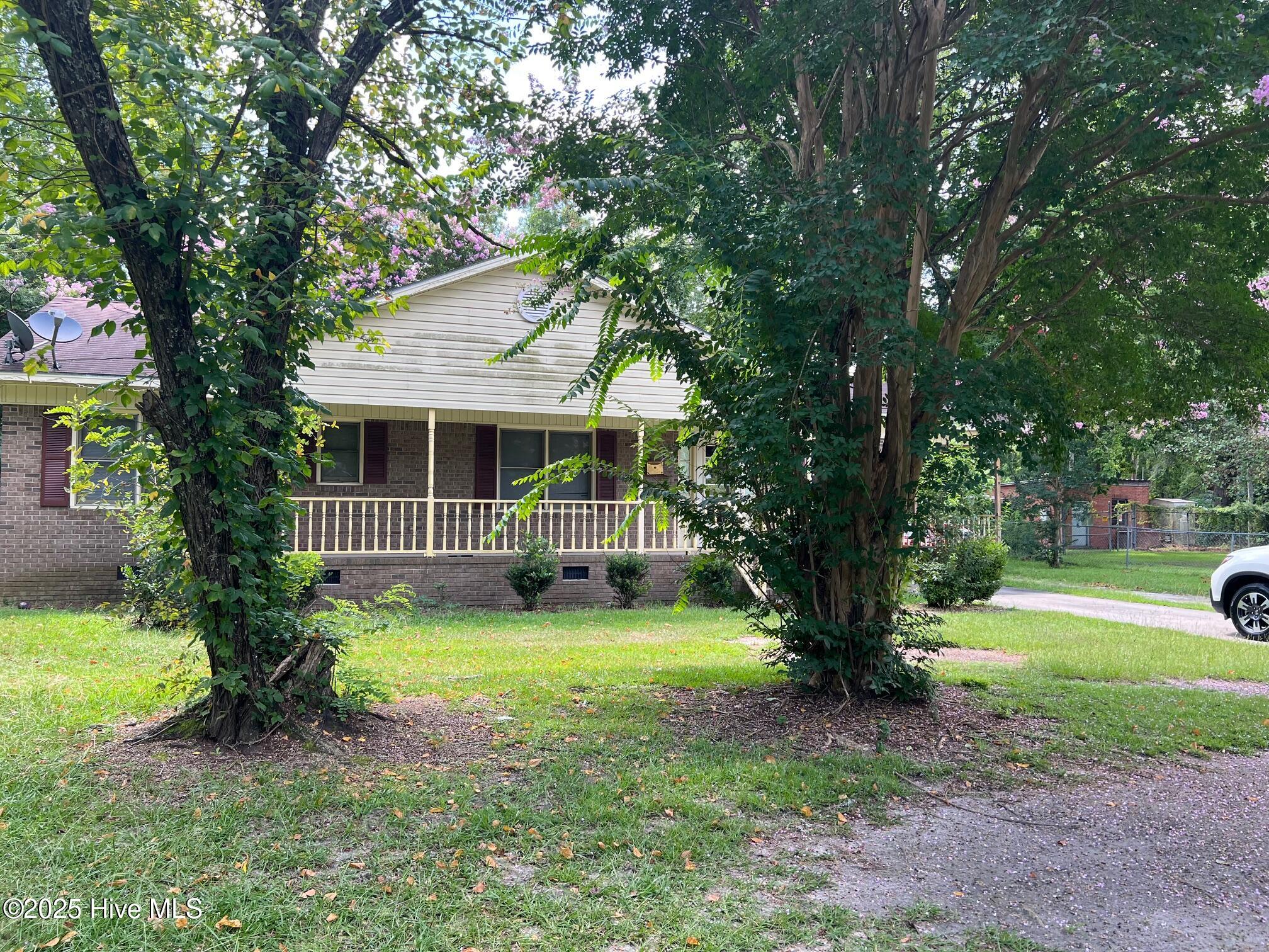 Looking for a nice one level house in the heart of Williamston? This brick rambler--with a NEW ROOF-- is well-built and is good for families or for investors as it has a great rental history.  With a large half acre garden, it could be a gardener's dream.  The outside patio is perfect for your grill, and the yard is fenced in.  It's popular for its location as this is a quiet area.  However, it also works for families and children with the well-established climbing trees and nearby churches with playgrounds.  A convenient design includes an open kitchen, dining, and family room.  Bring your ideas and colors and transform it into a comfortable and pretty home, tailored to you!