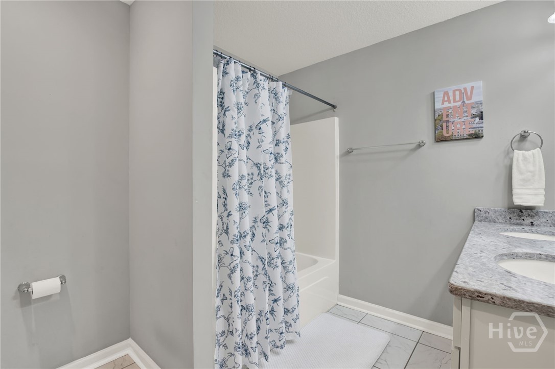 Upstairs Hall Bathroom with Double Vanity and Tub/Shower Combo