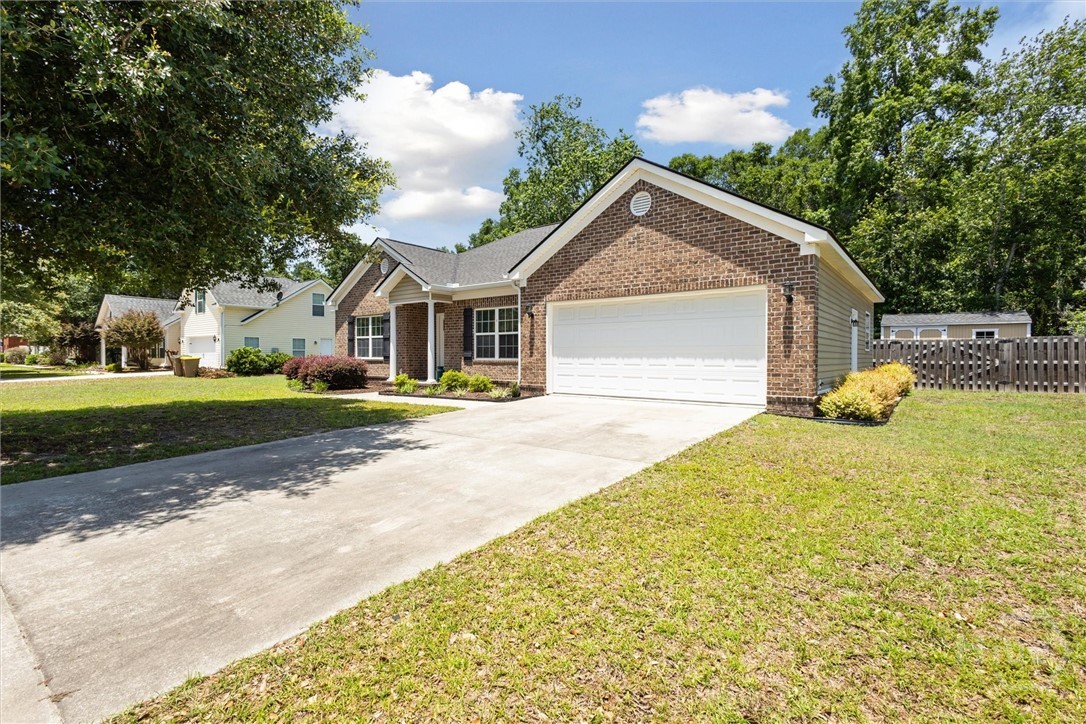 The double garage is 19'x21' and has a side exit d