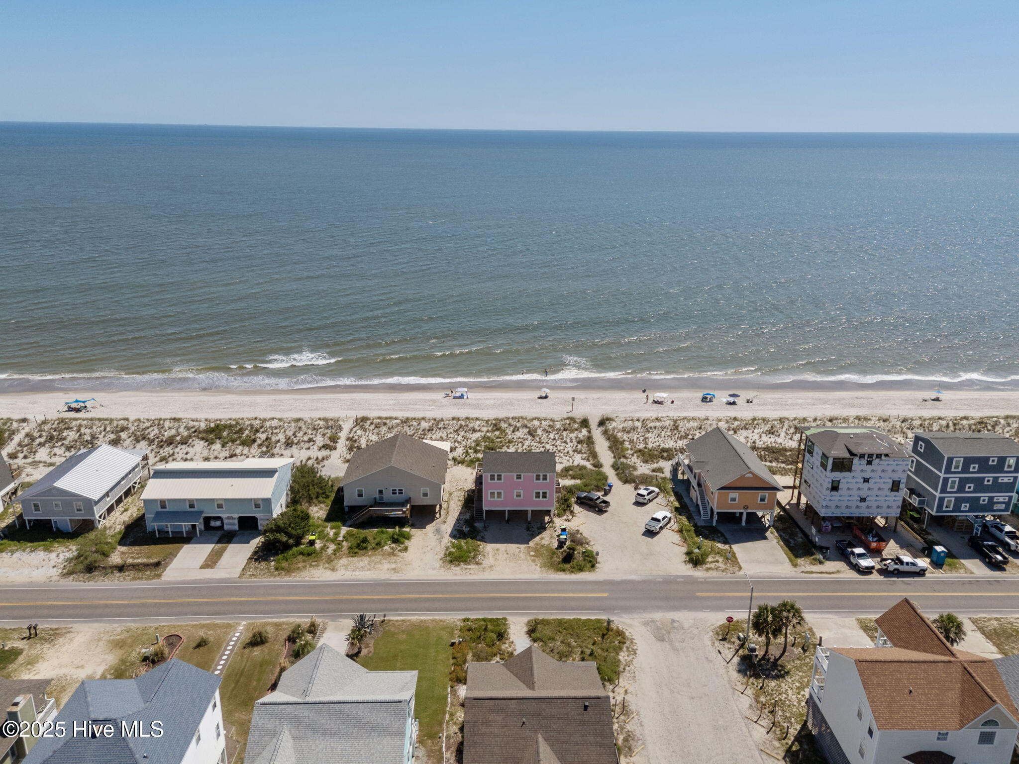601 E Beach Drive, Oak Island, NC 28465 – photo 3: 16-web-or-mls-DJI_20250903145036_0381_D