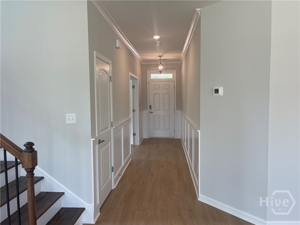 Wide Foyer with Wainscotting and Crown