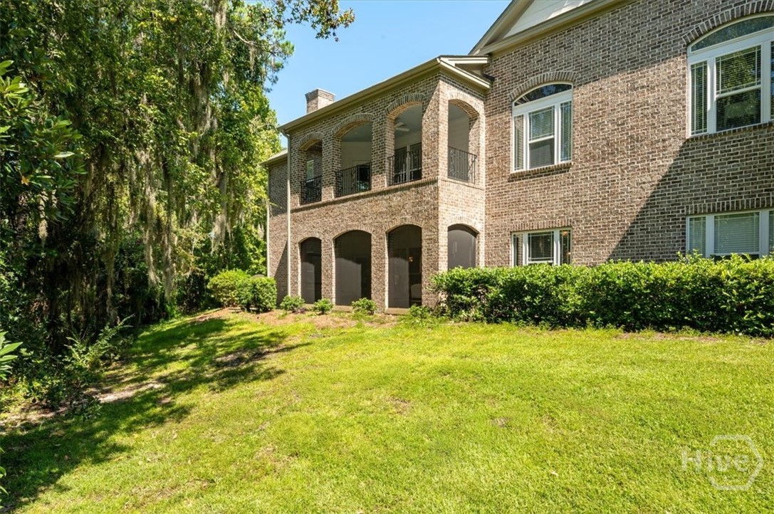 Bottom unit with a private, wooded back yard, scre