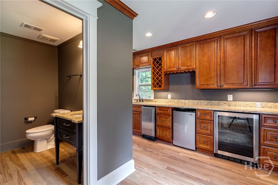 half bath and wet bar off den