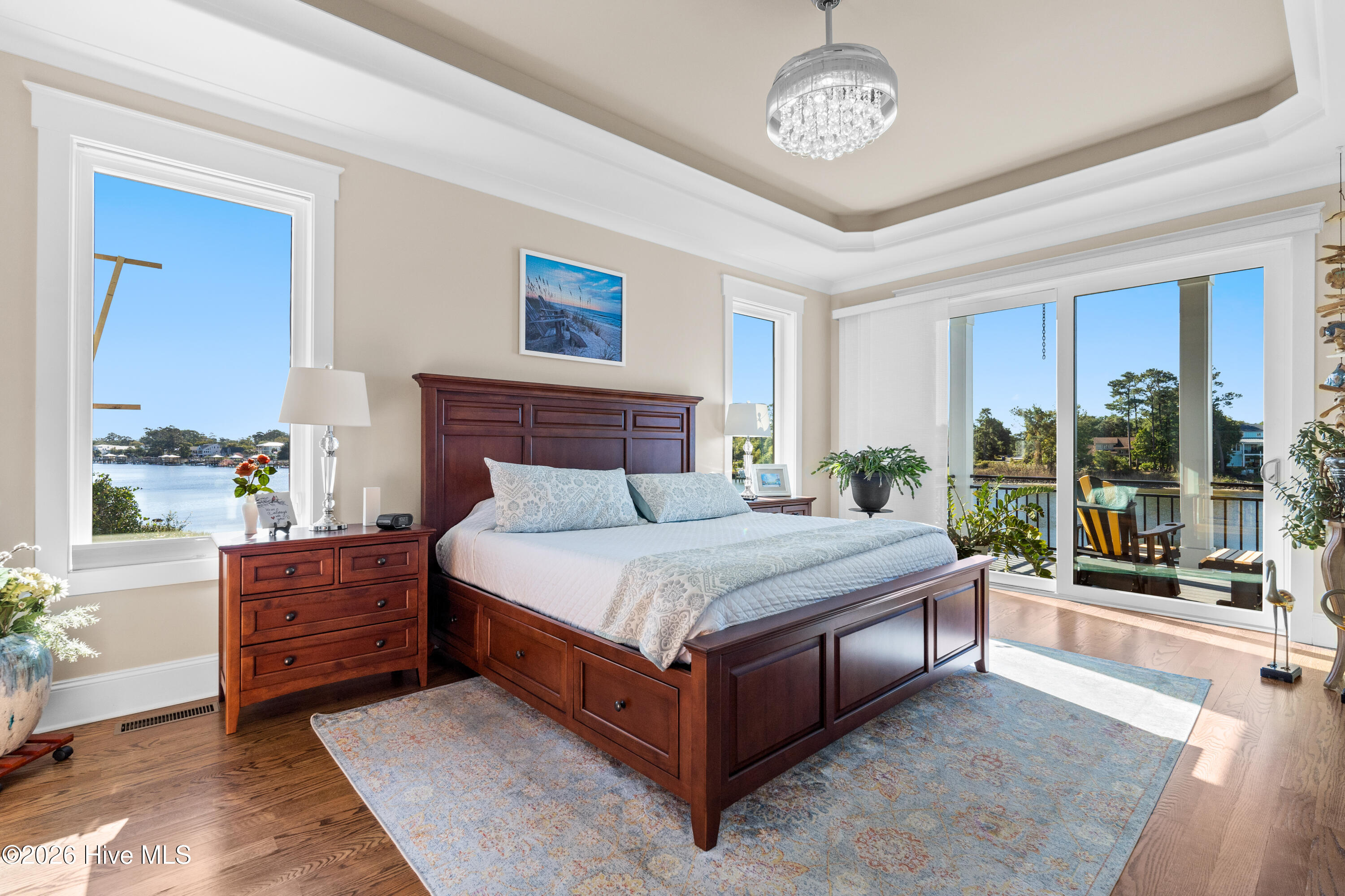 Spacious primary bedroom loaded with natural light
