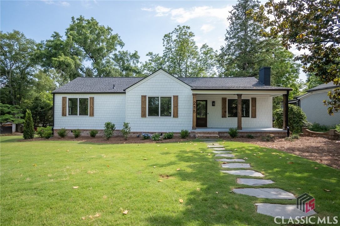 If you've been looking for a top to bottom renovated home in one of the BEST locations in Athens, then look no further...you just found it! This home might as well be considered new construction. It features a beautiful brand new custom kitchen that opens to the vaulted living and dining area. The all new modern kitchen features a built-in pantry, quartz countertops, tile back splash, gas range, and a huge island with seating for up to six, all located right in the middle of the home making entertaining effortless. The large master bedroom and bath are located in their own wing just off the rear foyer area. The master bedroom has three windows providing tons of natural light, a walk-in closet, as well as a huge 8-foot double door closet. The master bath features a free-standing soaker tub, large fully tiled shower, custom vanity w/quartz countertops, and a separate toilet room. The 3 additional bedrooms and 2 brand new full baths are located on the other side of the central kitchen. The entire home is covered in beautiful site finished white oak floors. There is a two car garage at the end of a new concrete driveway. Don't forget the covered front porch, and the new expansive rear deck. Other improvements include new cement board siding and trim, new windows and doors, completely new electrical and plumbing, a full re-paint of the interior and the exterior, new 30 yr roof, new HVAC system, new water heater, upgraded foam and blown insulation, as well as many others updates throughout. This home has it ALL, on a beautiful completely landscaped corner lot right in the middle of Normaltown! The listing broker is also the the owner.
