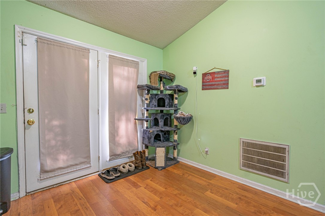 Living Room facing Back Door to Backyard