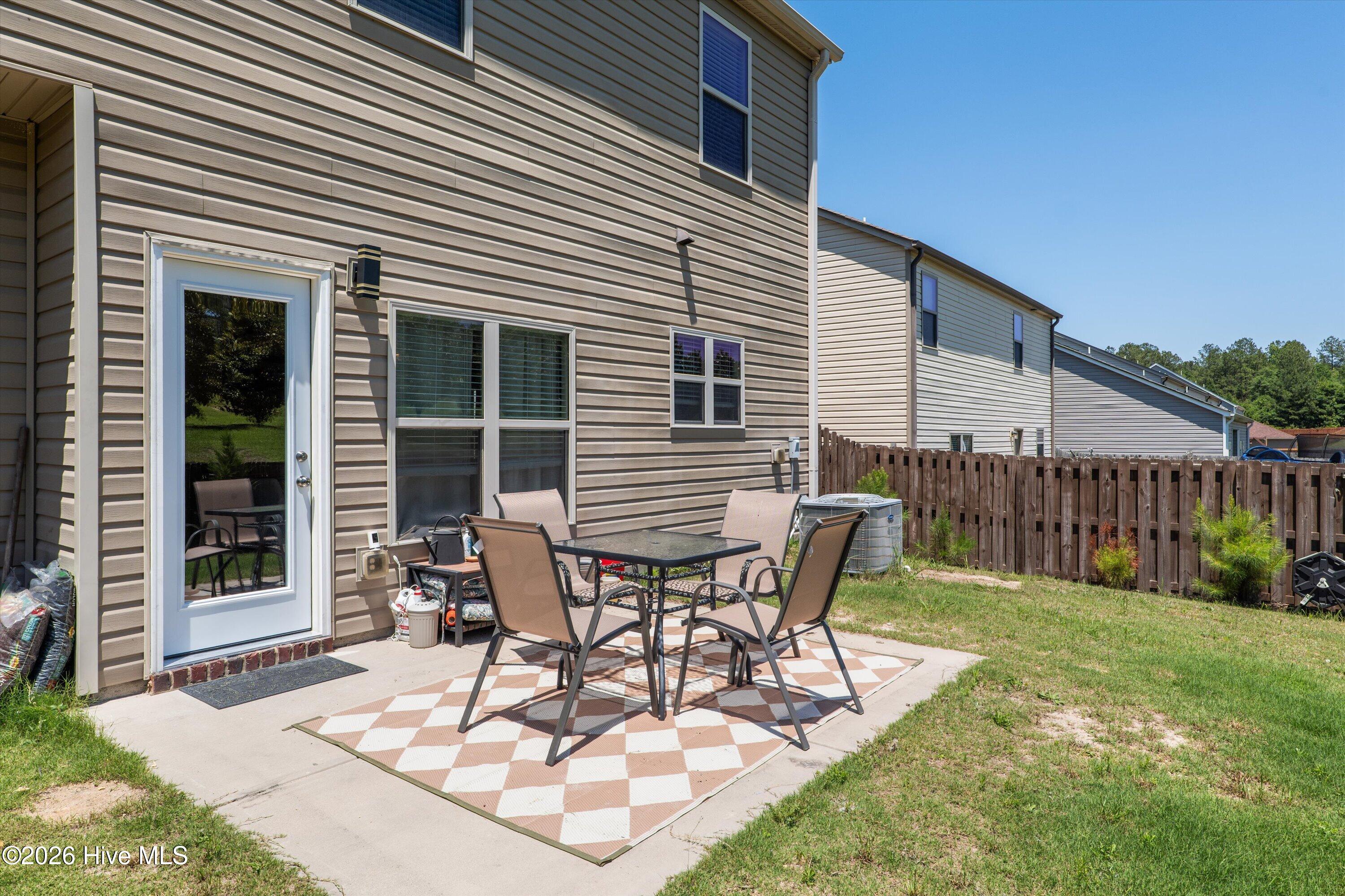 Patio area in privacy fenced yard