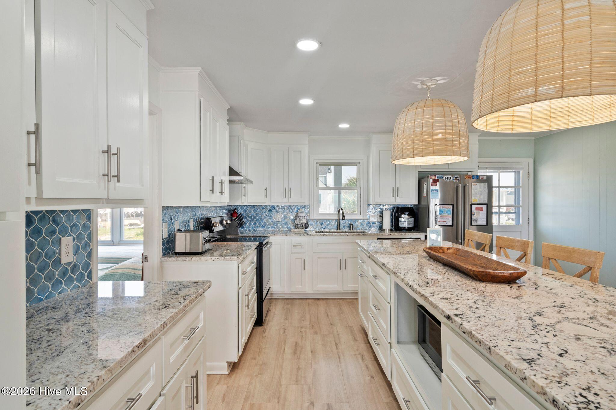 Exterior photo of 145 Ocean Boulevard W, Holden Beach, NC 28462. MLS: 100589190