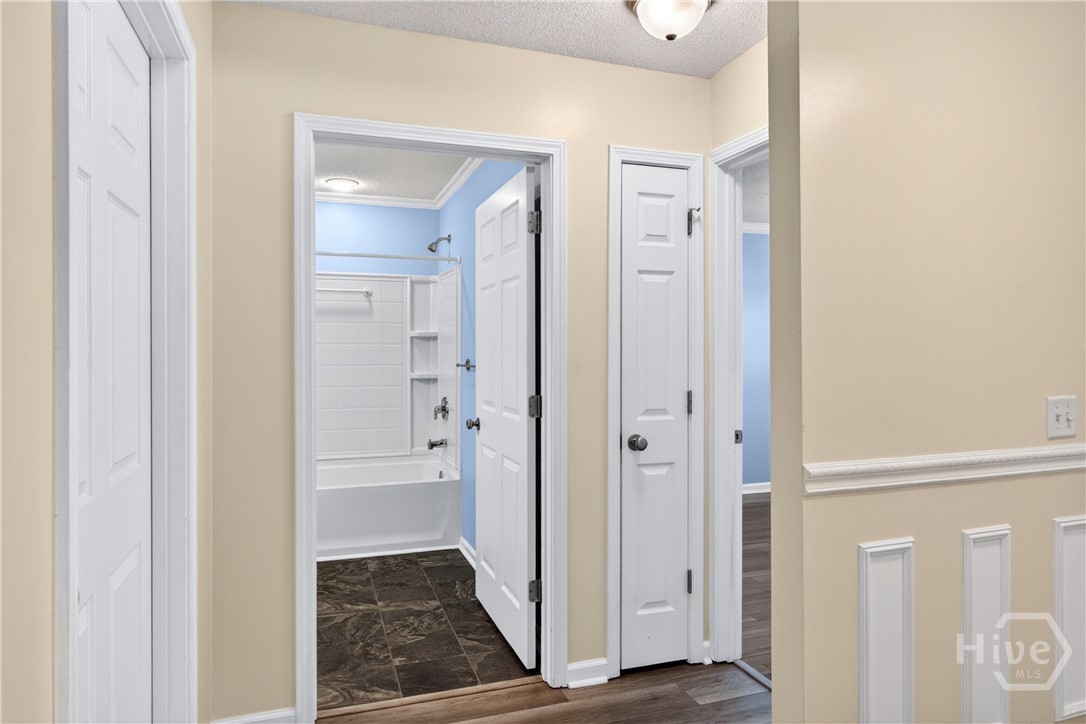 From the entry hall - guest room on your right, guest bath and laundry room to the left
