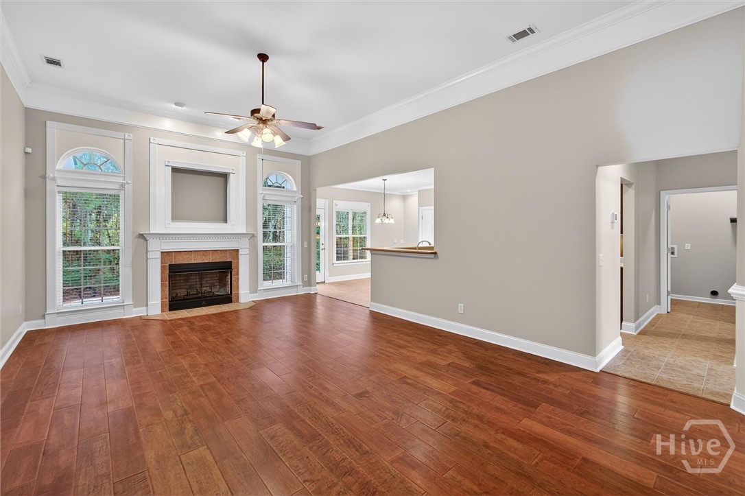Family room with view of hallway to garage and upstairs