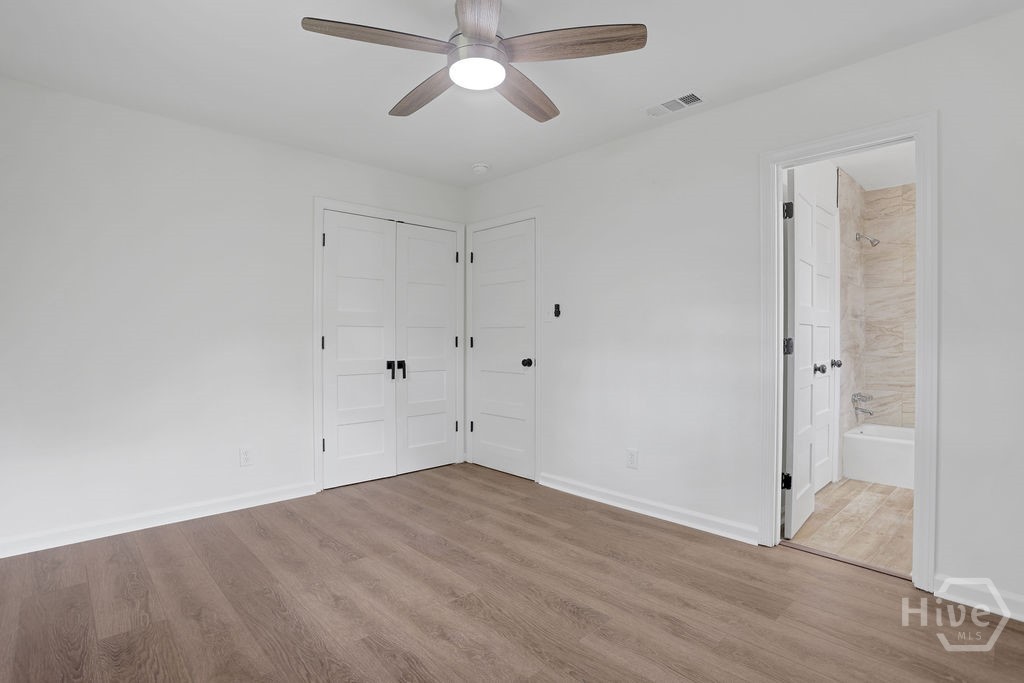 Primary bedroom with attached bathroom