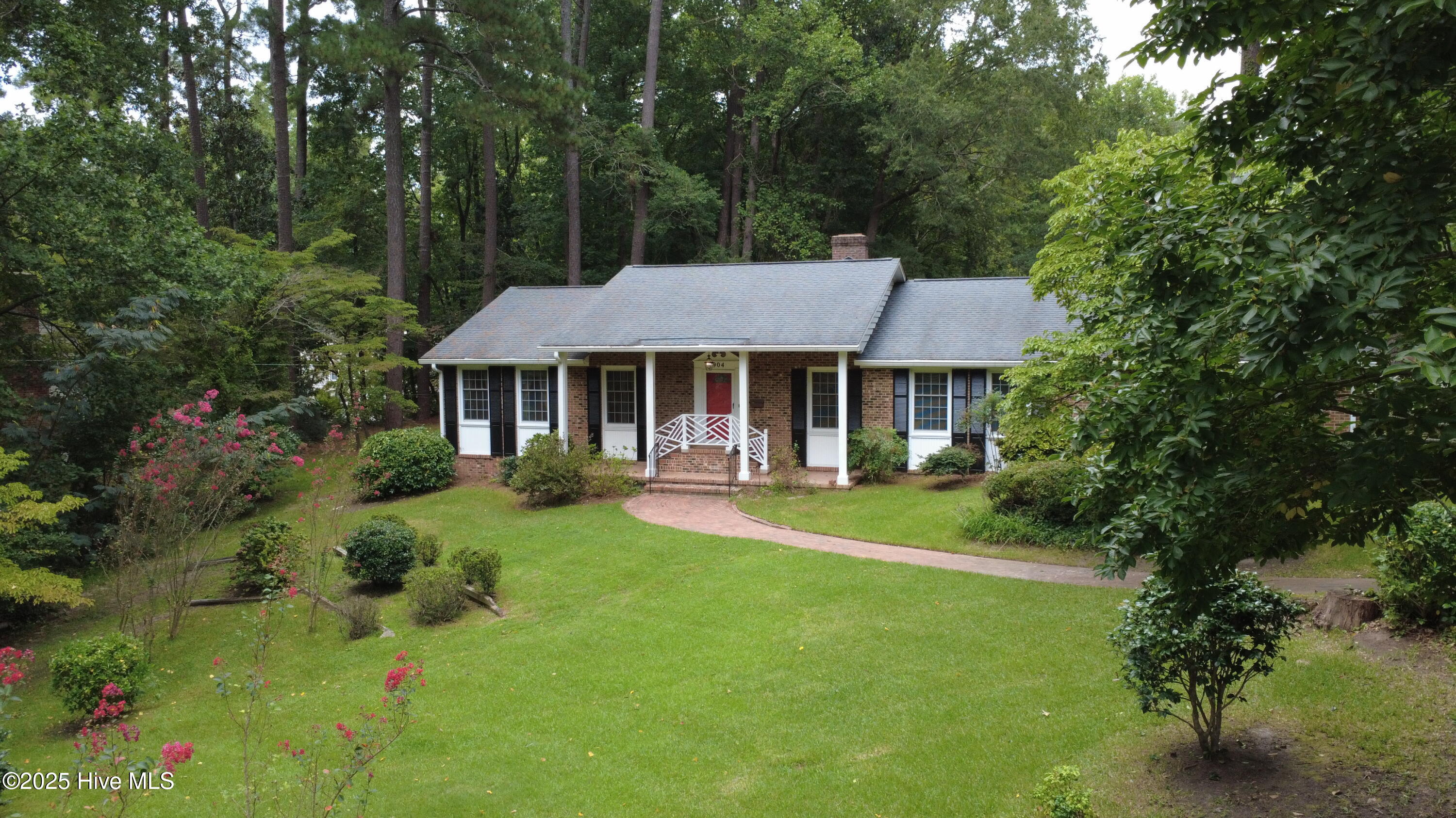 Lovely brick home nestled on deep lot in established neighborhood in Williamston. Hardwood floors in den with fireplace and formal living and dining rooms. Custom drapes in living room. 3 bedrooms, 2 full baths built-in shelving and desk in family room. Master has large walk-in closet. Kitchen has custom built revolving pantry, stove, refrigerator. Washer & dryer included. Extra refrigerator and freezer in storage room of 2 car garage. Sunroom has separate zone line hvac and a wet bar and wine cooler for 24 + bottles. Brick patio for outdoor entertaining. Fenced in back yard for your 4 legged friends. Air purifier on hvac. Natural gas and whole house Generac generator. Lot is 125 X 150, .43 acre. House is in very walkable neighborhood and is near the Roanoke River National Refuge with lots of creeks, etc. 4-5 blocks from Martin Memorial Library and Downtown post office.