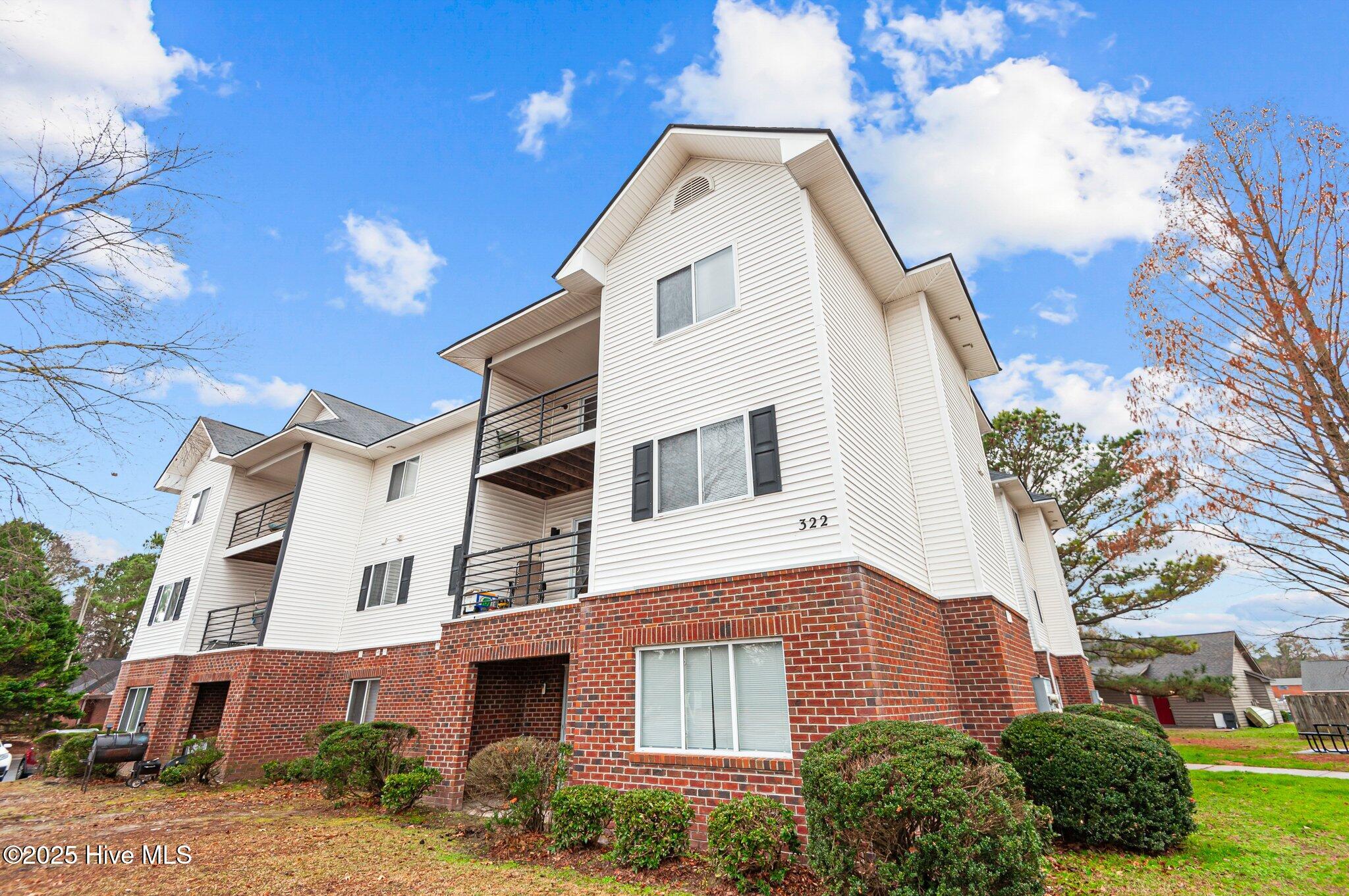 Live where convenience meets comfort at 322 Brownlea Drive Unit E3 in University Terrace! This 3-bedroom, 3-bathroom third-floor condo is just minutes from ECU's main campus—perfect for students, investors, or anyone who wants to be close to the action. Each spacious bedroom is a mini-suite, complete with its own full bathroom and walk-in closet, offering privacy and plenty of personal space. The open-concept living area connects to a covered patio—perfect for relaxing or catching a breath of fresh air between classes. You'll also love the large laundry room with built-in storage, making daily chores a breeze. The fully equipped kitchen flows easily into the living and dining spaces, and there's convenient parking right outside. Whether you're walking or biking to campus, grabbing coffee, or heading out for the evening, your favorite hangouts are just around the corner. Whether you're settling in or investing smart, this condo offers the space, location, and flexibility to fit your lifestyle.