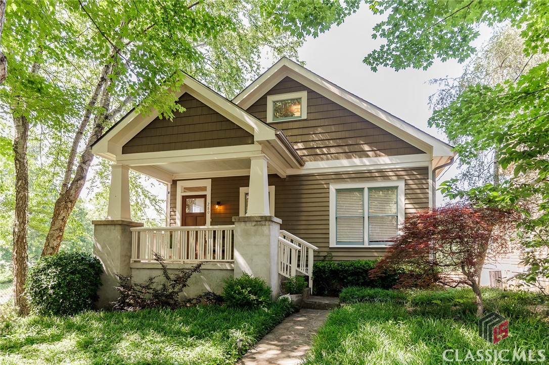 This beautifully maintained 4 bedroom, 3 bath home offers over 2,000 square feet of living space plus the added bonus of a fully finished attic—making it the only home in this sought-after enclave with this unique extra square footage. Tucked at the end of a quiet, low-traffic street, this Craftsman-style cottage combines charm, space, and convenience in one of Athens' most beloved neighborhoods.The charming flagstone path and classic front porch invite you into a light-filled open layout featuring hardwood floors throughout. The living and dining areas flow into a comfortable kitchen with granite counters, stainless steel appliances, and a breakfast bar. The main level includes three bedrooms, including a spacious owner’s suite with a walk-in closet, dual vanities, soaking tub, and tiled shower. Two additional bedrooms share a hall bath, and a separate laundry and pantry add practical ease.Upstairs, an expansive second primary suite spans the full top floor, complete with hardwoods, a walk-in closet, and a large ensuite bathroom.Out back, enjoy a private deck that overlooks the fully fenced backyard—perfect for entertaining or simply unwinding. A deep drive-under garage offers secure parking and storage, with alley access and additional off-street parking available. Incredible location—walkable to Normaltown, Boulevard, Prince Ave, and local favorites like cafes, yoga studios, and the Chase Street Warehouse District. Zoned for Chase Street Elementary and just minutes from downtown. Quiet, connected, and truly move-in ready.